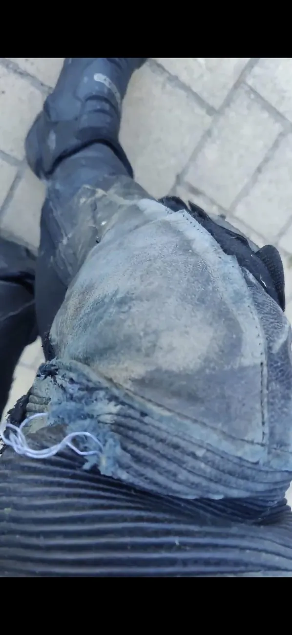 Abrasion marks on leather race suit panels after a low-side slide