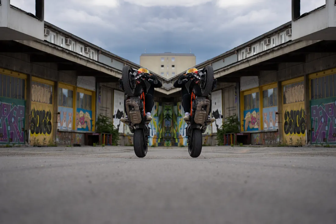 Two motorcycle riders wearing Nackabatzi made-to-measure leather race suits